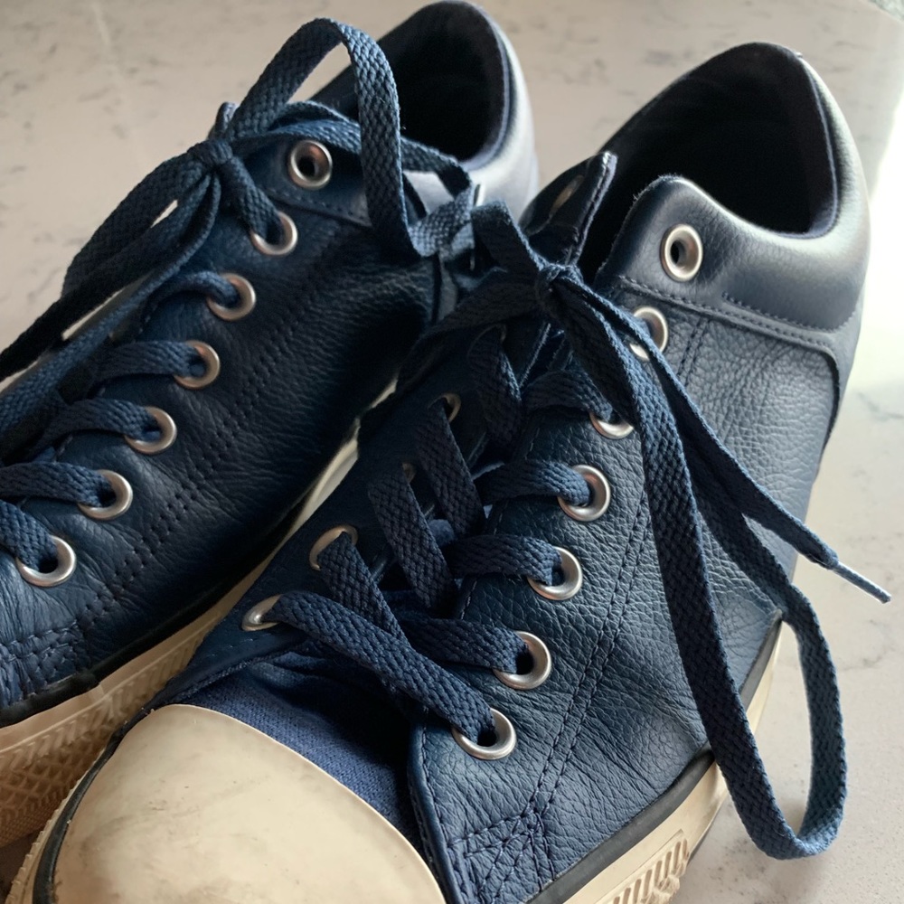 Blue low top converse leather shoes slightly used